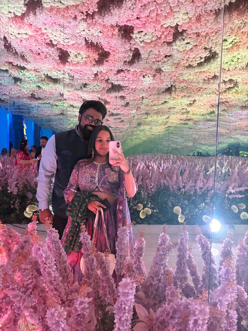 Shraddha and Arian by a floral mirror