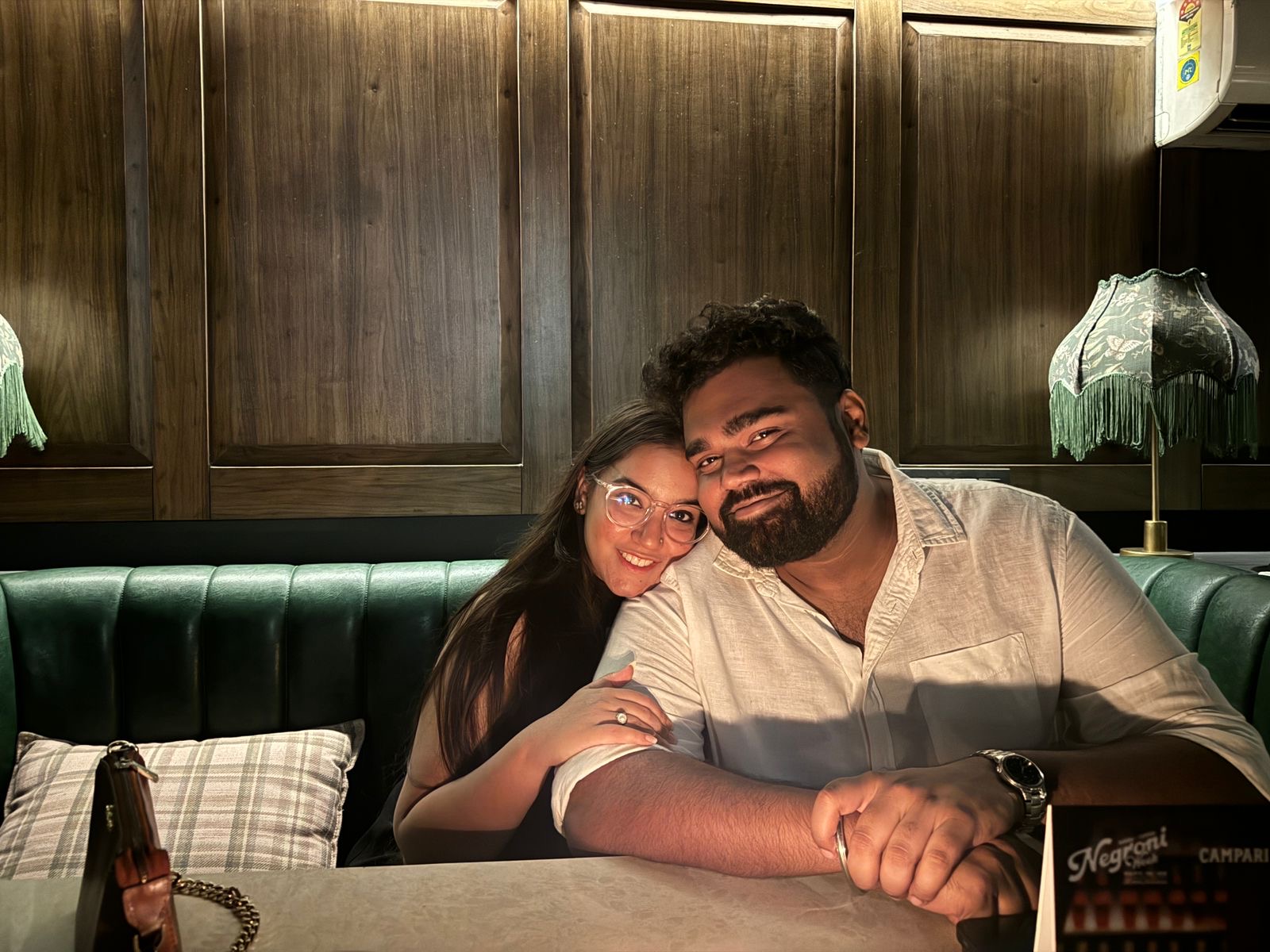 Portrait of Shraddha and Arian at a restaurant